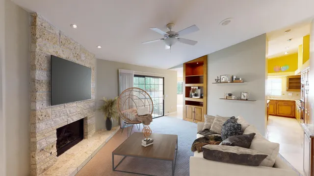 a kitchen with stainless steel appliances granite countertop a stove top oven a refrigerator a sink and dishwasher