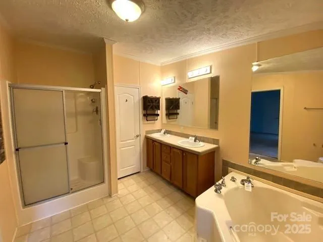 a kitchen with stainless steel appliances granite countertop a refrigerator and a stove