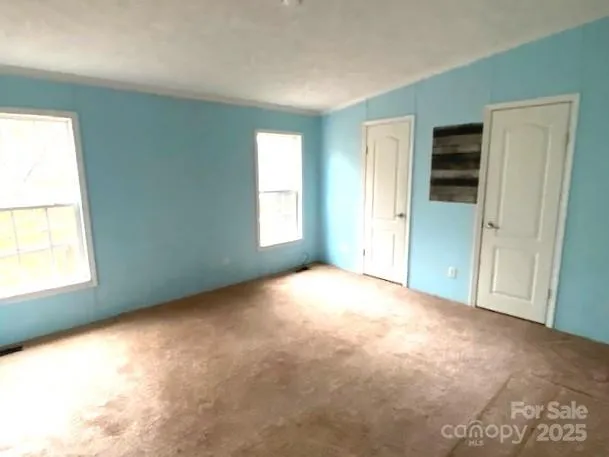 an empty room with windows