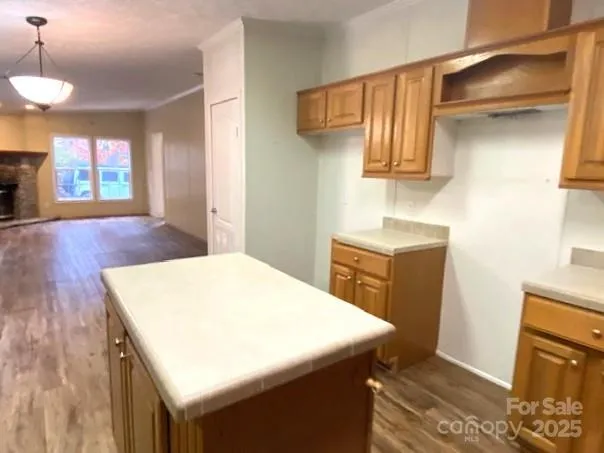 a kitchen that has a sink and a stove in it