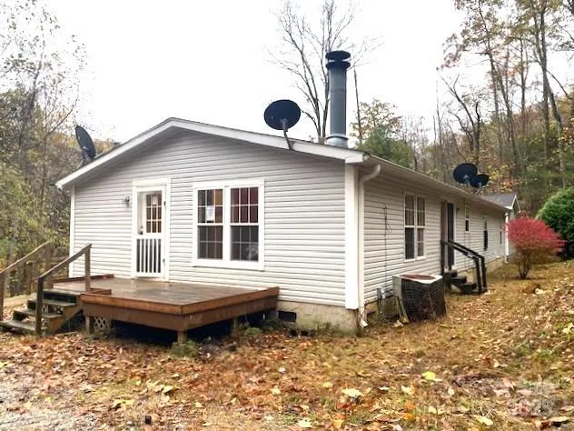 a backyard of a house with yard and barbeque oven