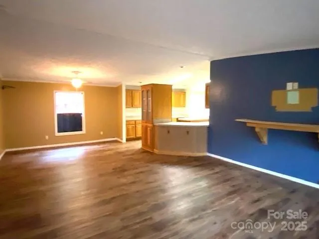 a view of a livingroom with a kitchen