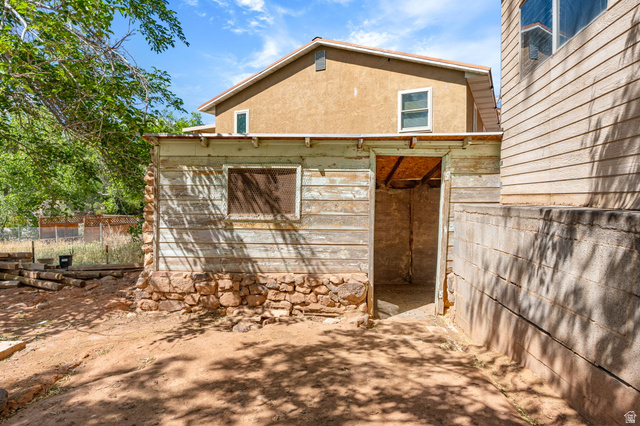 55 Spring Drive Toquerville, UT 84774 - Photo 28 of 36 View of side of property featuring stucco siding chicken coop