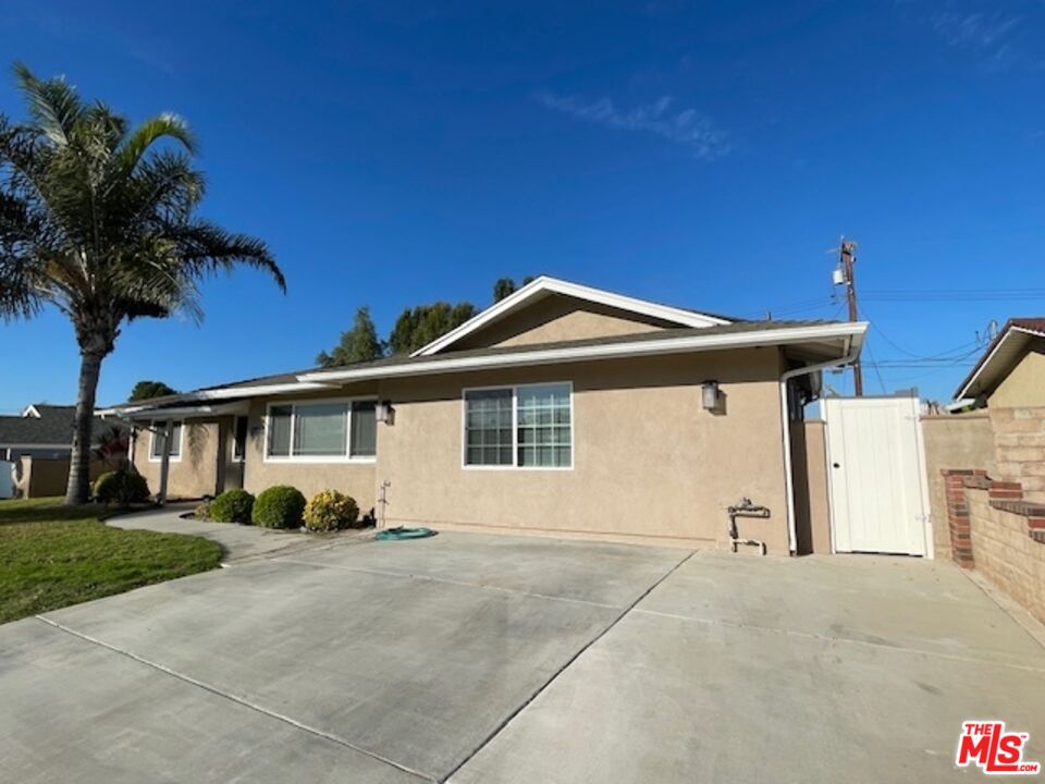 2615 Elizondo Avenue, Unit 2 Simi Valley, CA 93065 - Photo 1 of 20 a front view of a house with garden