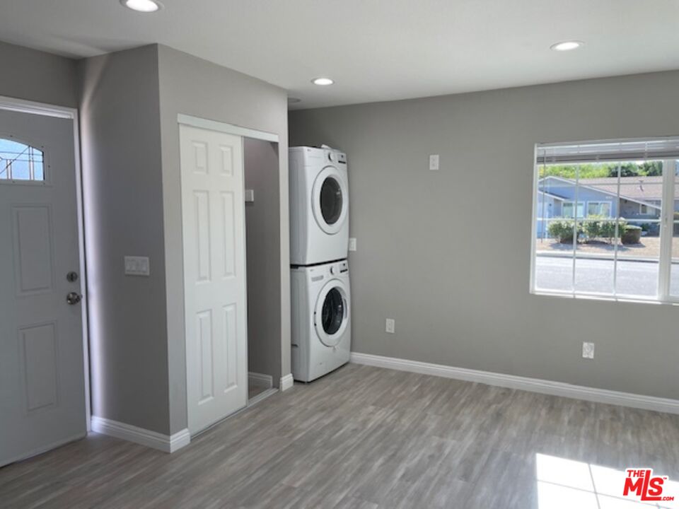2615 Elizondo Avenue, Unit 2 Simi Valley, CA 93065 - Photo 14 of 20 a view of an empty room with wooden floor and a window