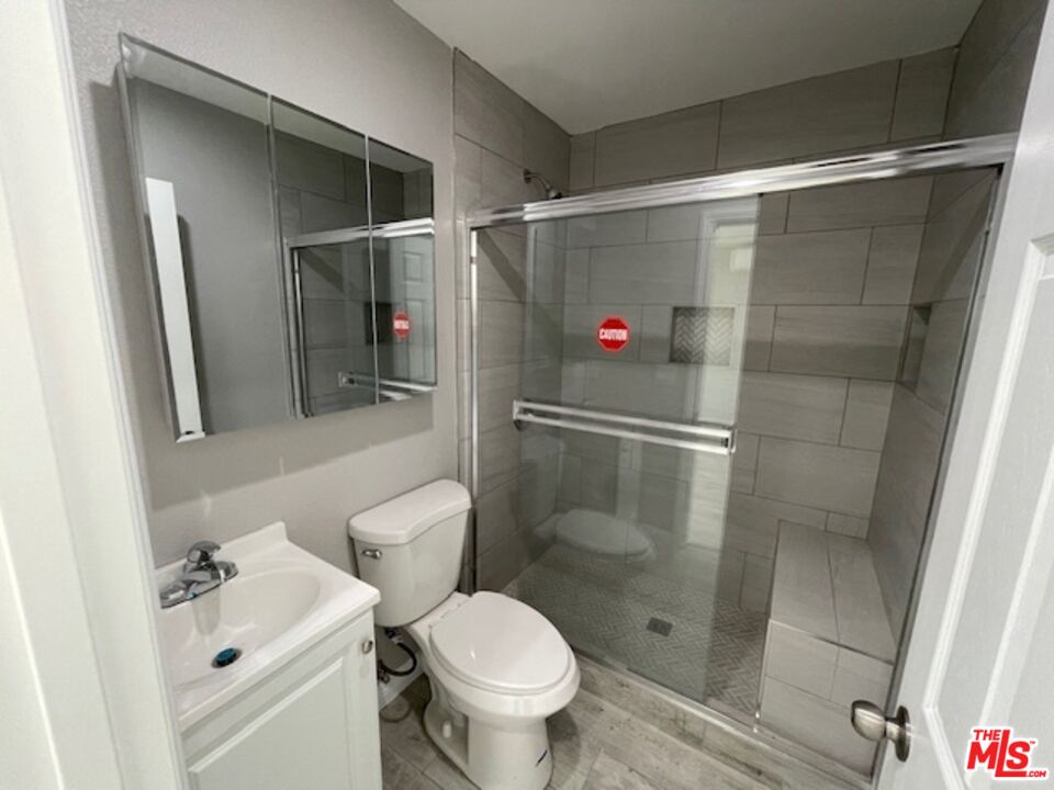 2615 Elizondo Avenue, Unit 2 Simi Valley, CA 93065 - Photo 9 of 20 a bathroom with a shower and a toilet