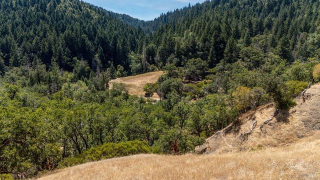 a view of outdoor space with mountain view in back