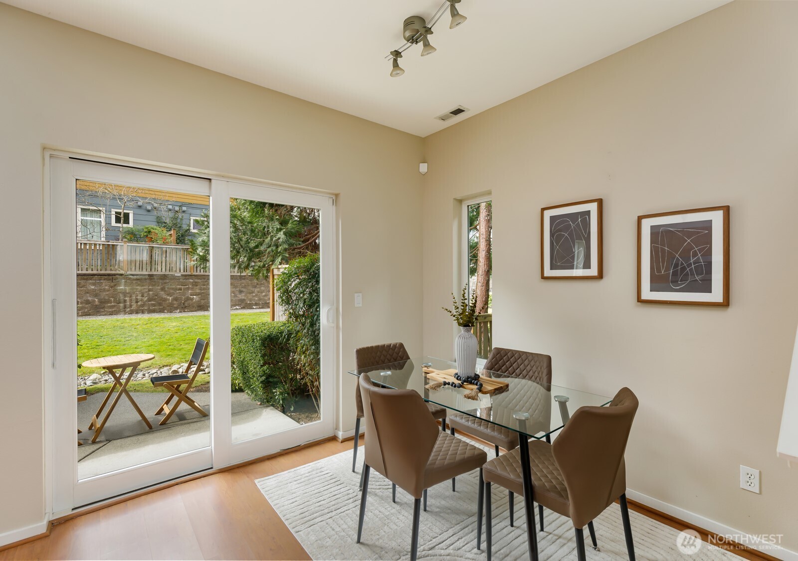 133 Cougar Ridge Road Northwest, Unit 1405 Issaquah, WA 98027 - Photo 12 of 30 a dining room with furniture and a floor to ceiling window