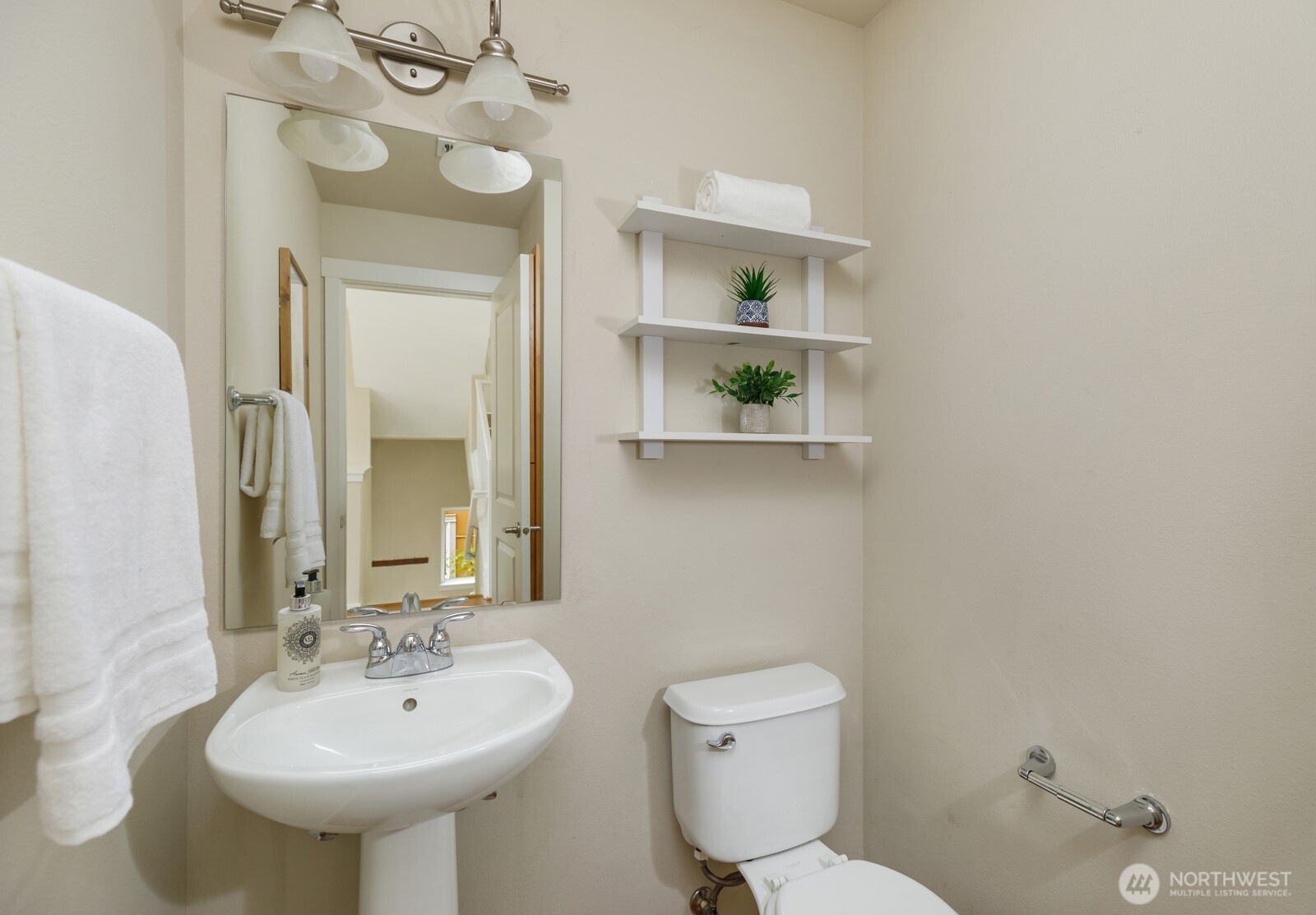 133 Cougar Ridge Road Northwest, Unit 1405 Issaquah, WA 98027 - Photo 13 of 30 a bathroom with a sink a toilet and mirror