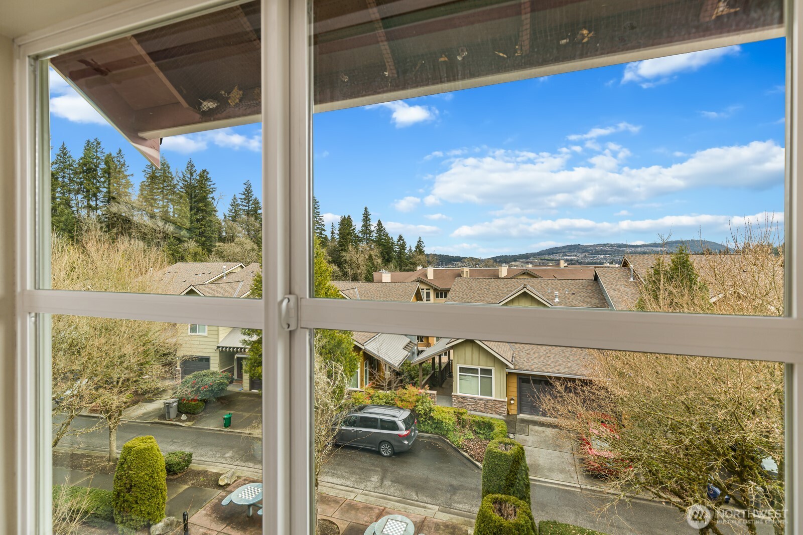 133 Cougar Ridge Road Northwest, Unit 1405 Issaquah, WA 98027 - Photo 16 of 30 a view of a balcony with couches and city view