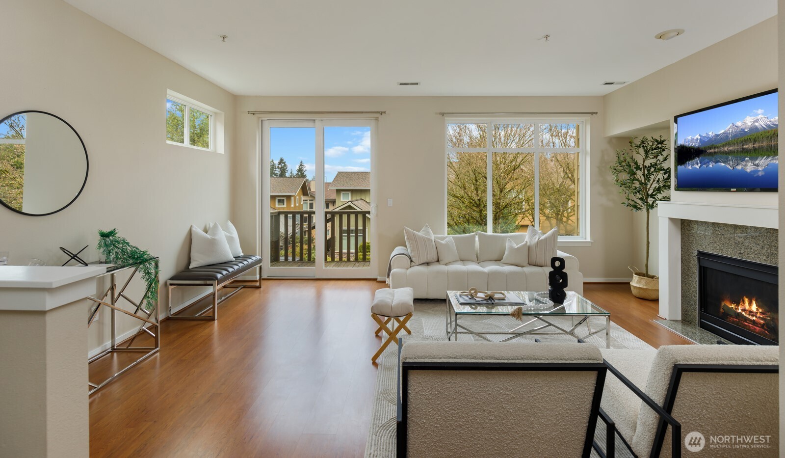 133 Cougar Ridge Road Northwest, Unit 1405 Issaquah, WA 98027 - Photo 2 of 30 a living room with furniture a flat screen tv and a fireplace
