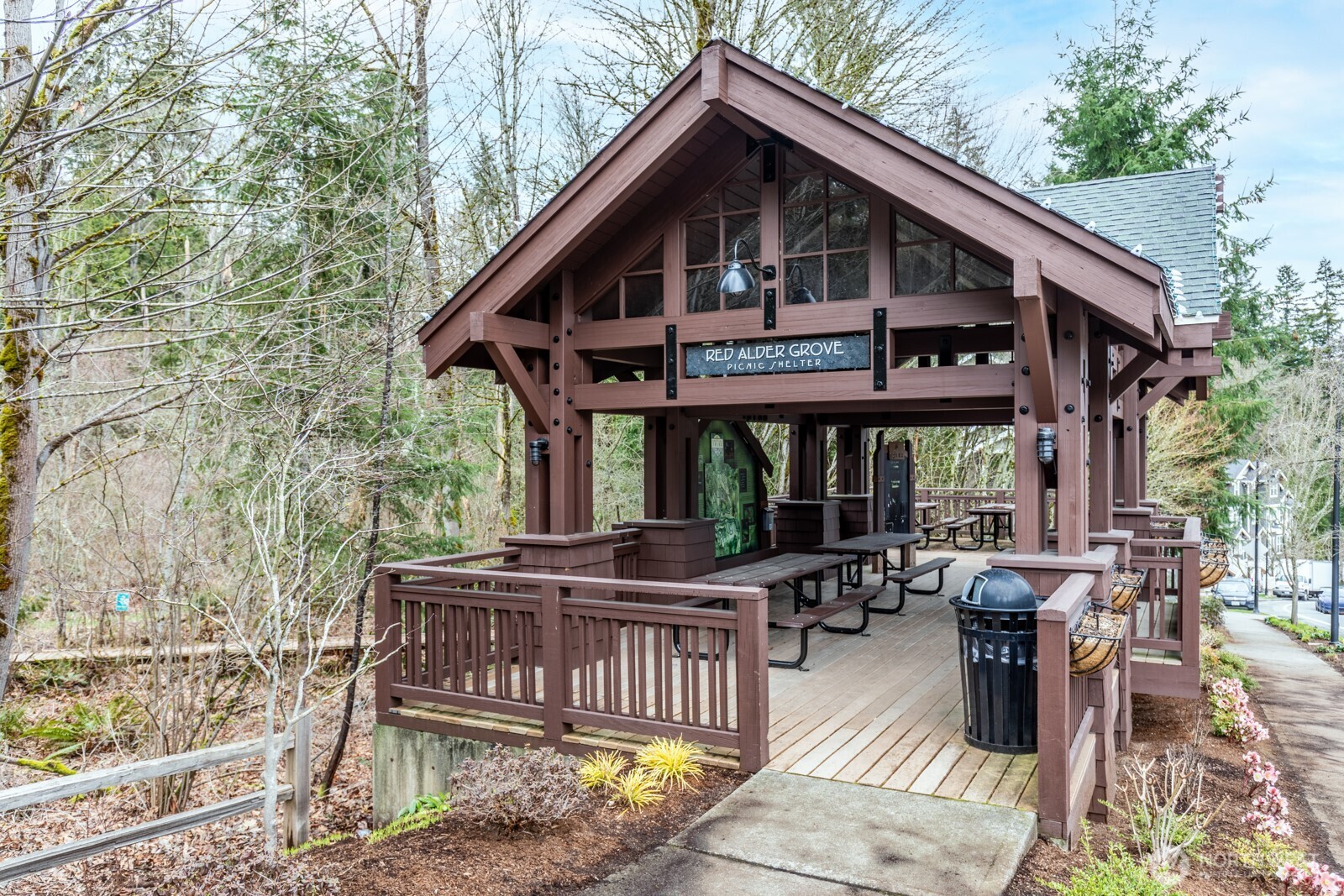 133 Cougar Ridge Road Northwest, Unit 1405 Issaquah, WA 98027 - Photo 29 of 30 a view of a house with a porch and furniture