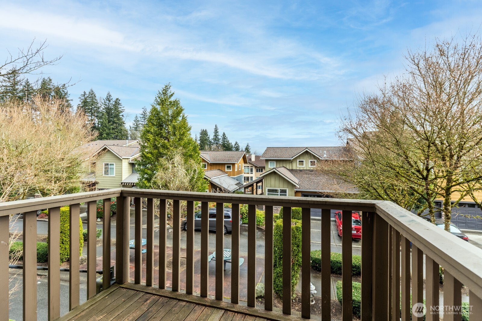 133 Cougar Ridge Road Northwest, Unit 1405 Issaquah, WA 98027 - Photo 5 of 30 a view of a balcony with wooden fence and floor