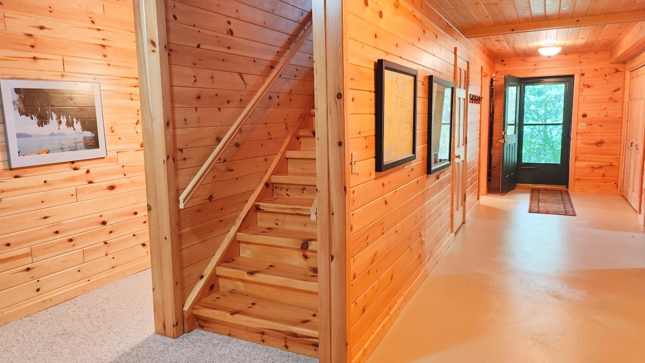 2357 Retreat Lodge Road Cook, MN 55723 - Photo 38 of 45 Stairway with wood walls and wooden ceiling