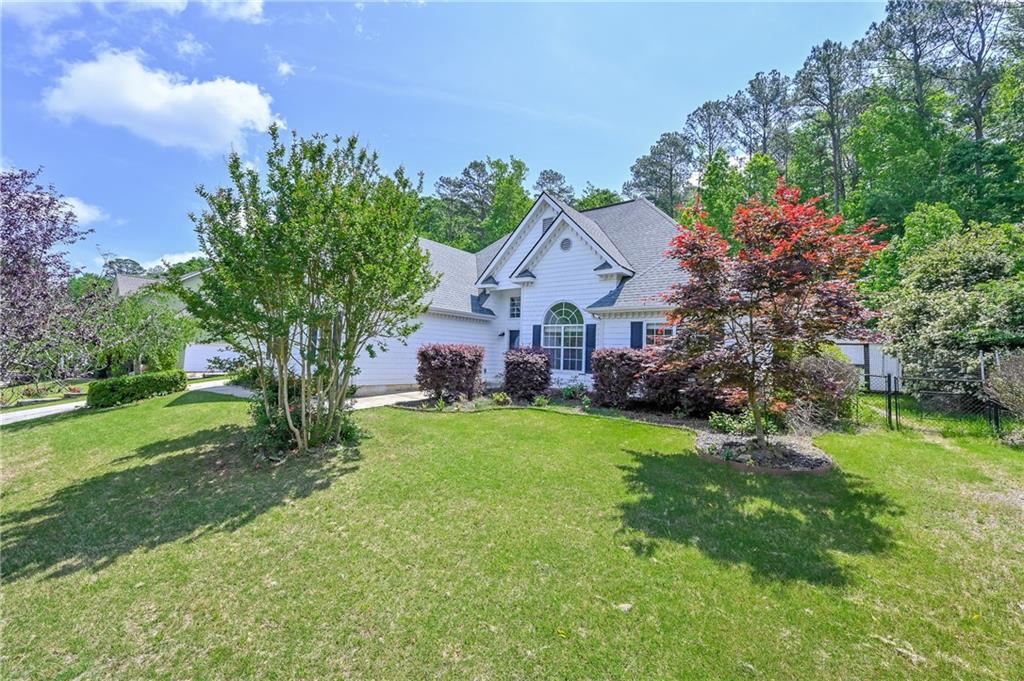 273 Ryan Road Winder, GA 30680 - Photo 1 of 1 a front view of a house with garden