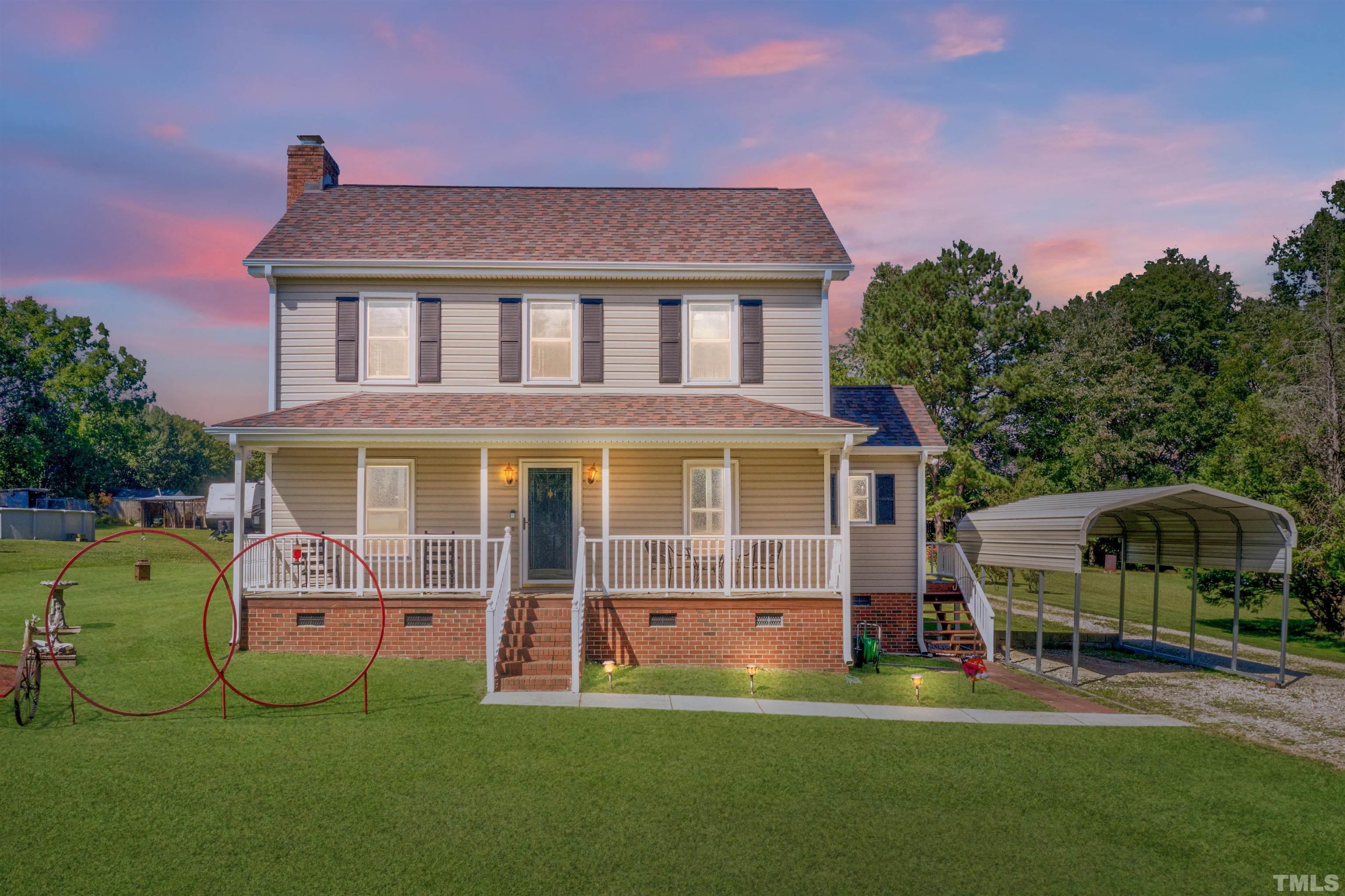429 South Meadow Road Raleigh, NC 27603 - Photo 1 of 44 a front view of a house with a garden and porch
