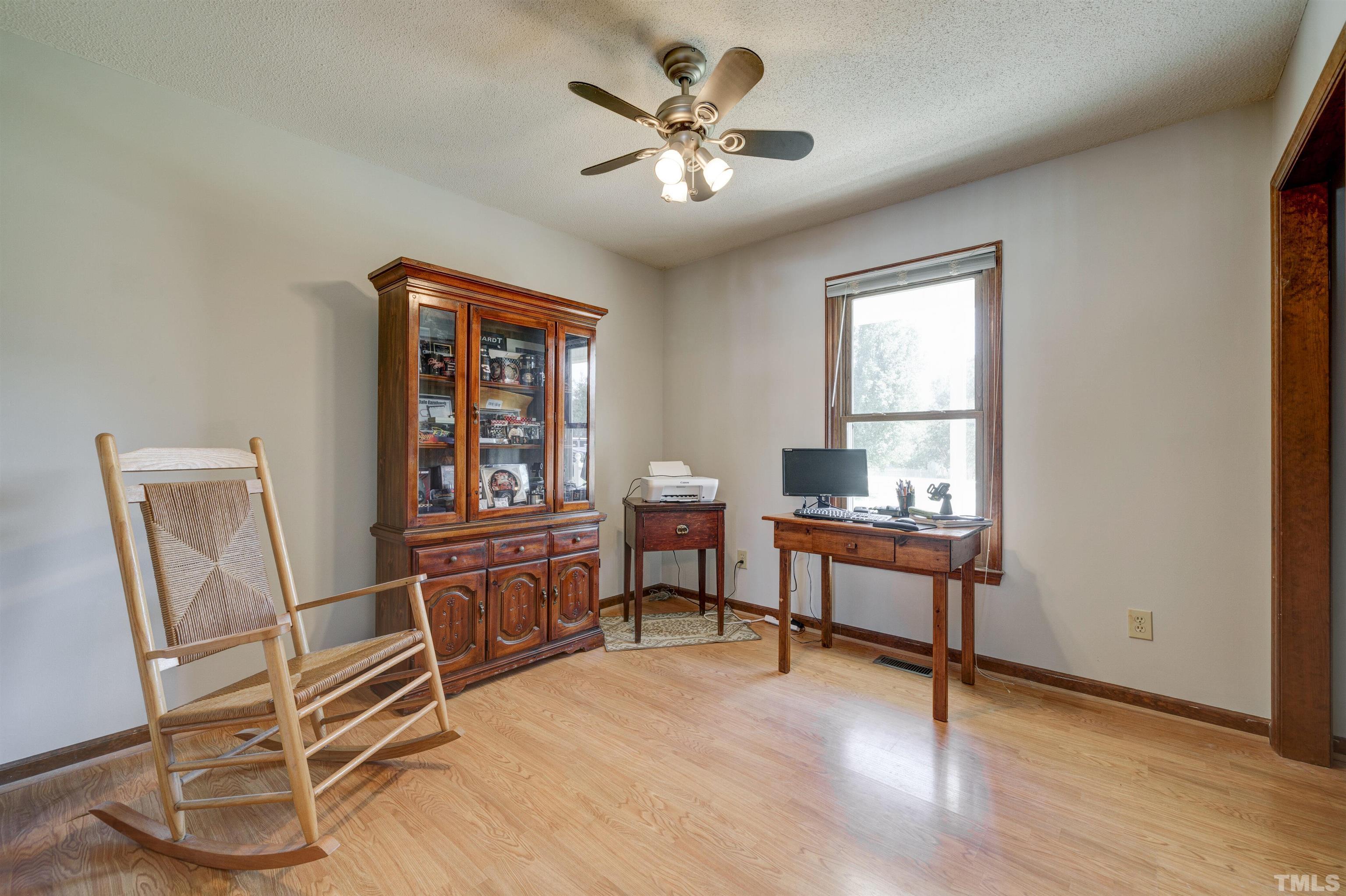 429 South Meadow Road Raleigh, NC 27603 - Photo 16 of 44 a living room with furniture and a window