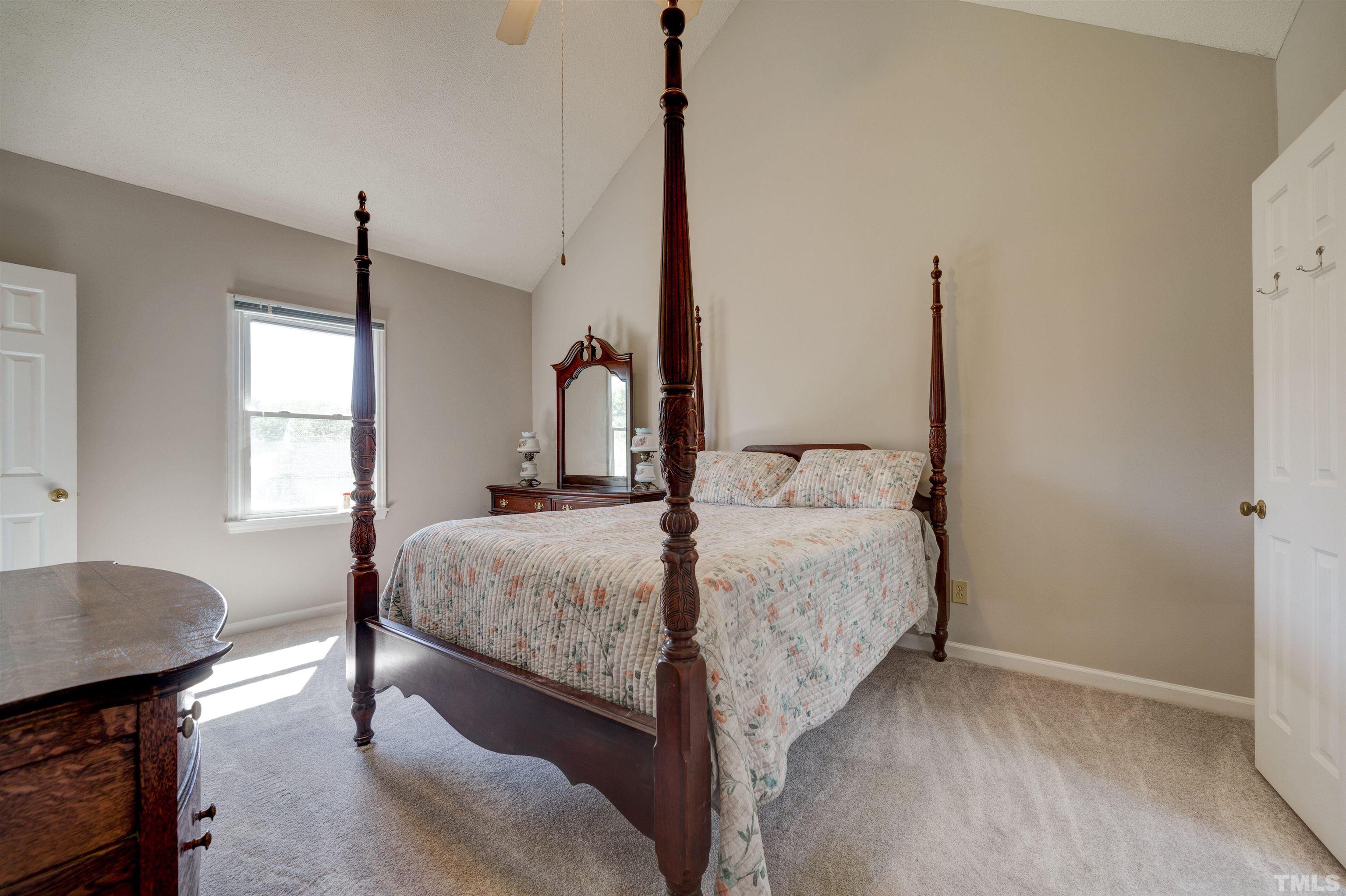 429 South Meadow Road Raleigh, NC 27603 - Photo 18 of 44 a bed sitting in a bedroom next to a window