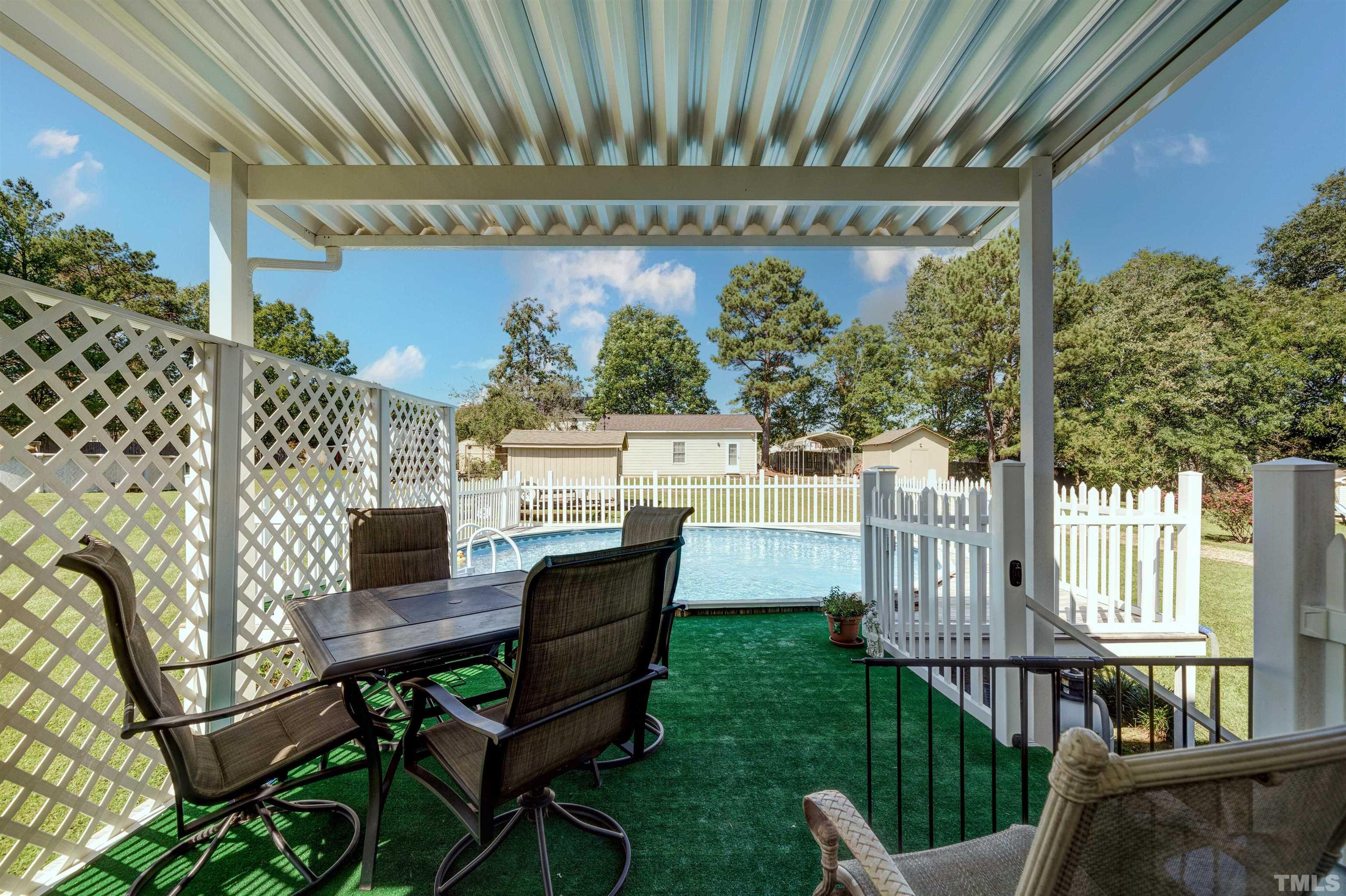 429 South Meadow Road Raleigh, NC 27603 - Photo 28 of 44 a view of a porch with furniture and garden