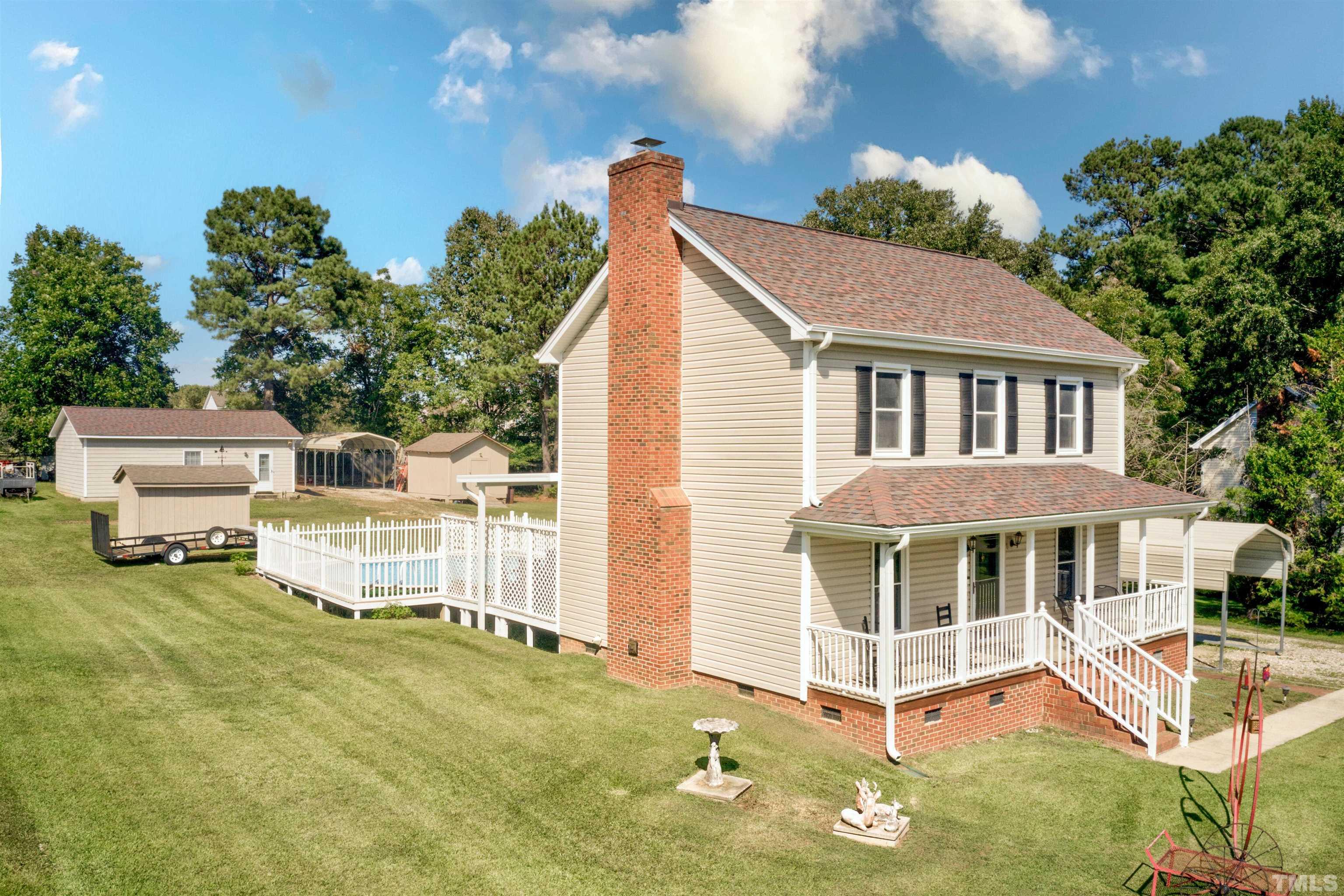 429 South Meadow Road Raleigh, NC 27603 - Photo 5 of 44 a view of a house with a yard and potted plants