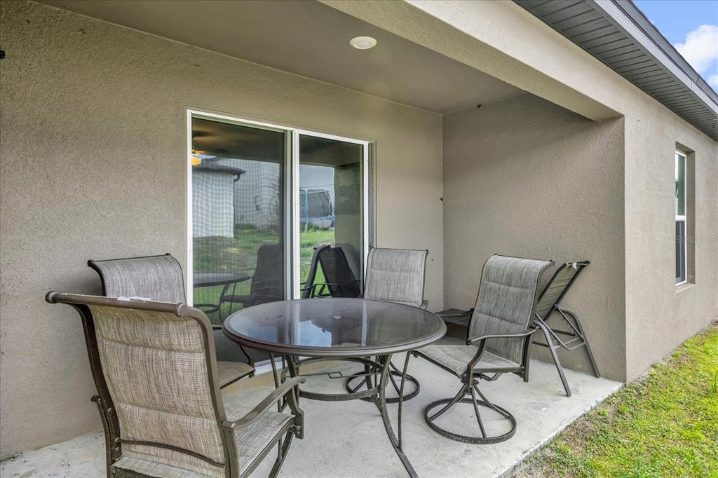 2134 Rio Grande Canyon Loop Poinciana, FL 34759 - Photo 17 of 22 a view of a dining room with furniture wooden floor and a potted plant