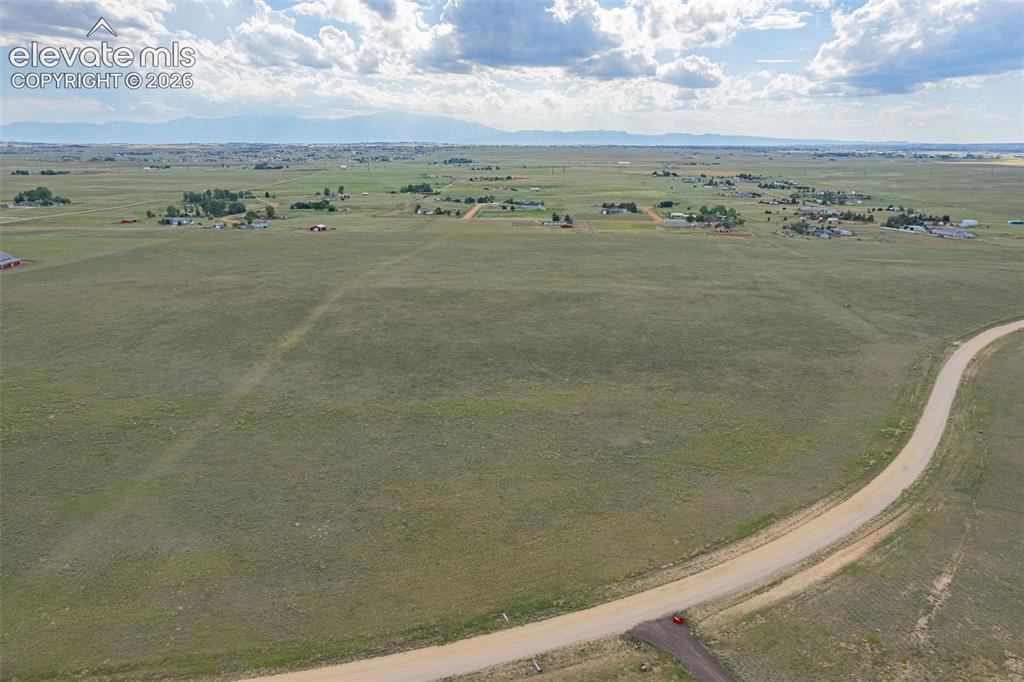 6870 Cowboy Rnch View Peyton, CO 80831 - Photo 1 of 16 a view of a field with an ocean