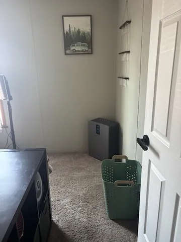 a living room with furniture and a gate