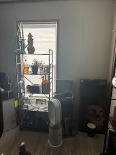 a room with a wooden floor and a table