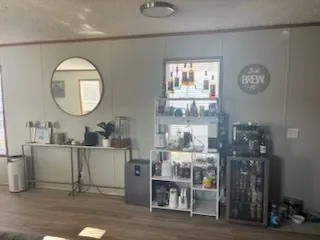 a bathroom with a sink mirror and vanity