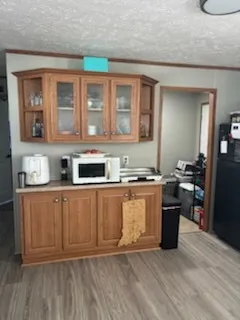 a large kitchen with stainless steel appliances granite countertop a stove and a sink