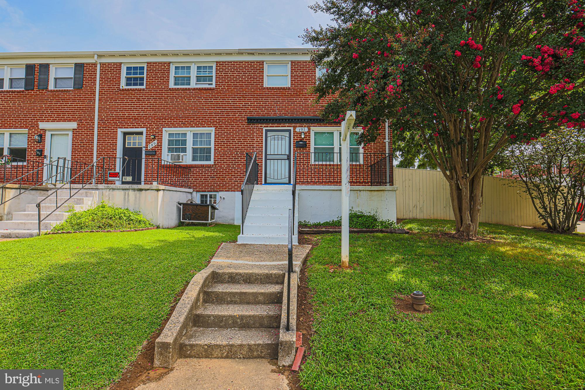 191 Alstun Road Essex, MD 21221 - Photo 1 of 40 a front view of house and yard with green space
