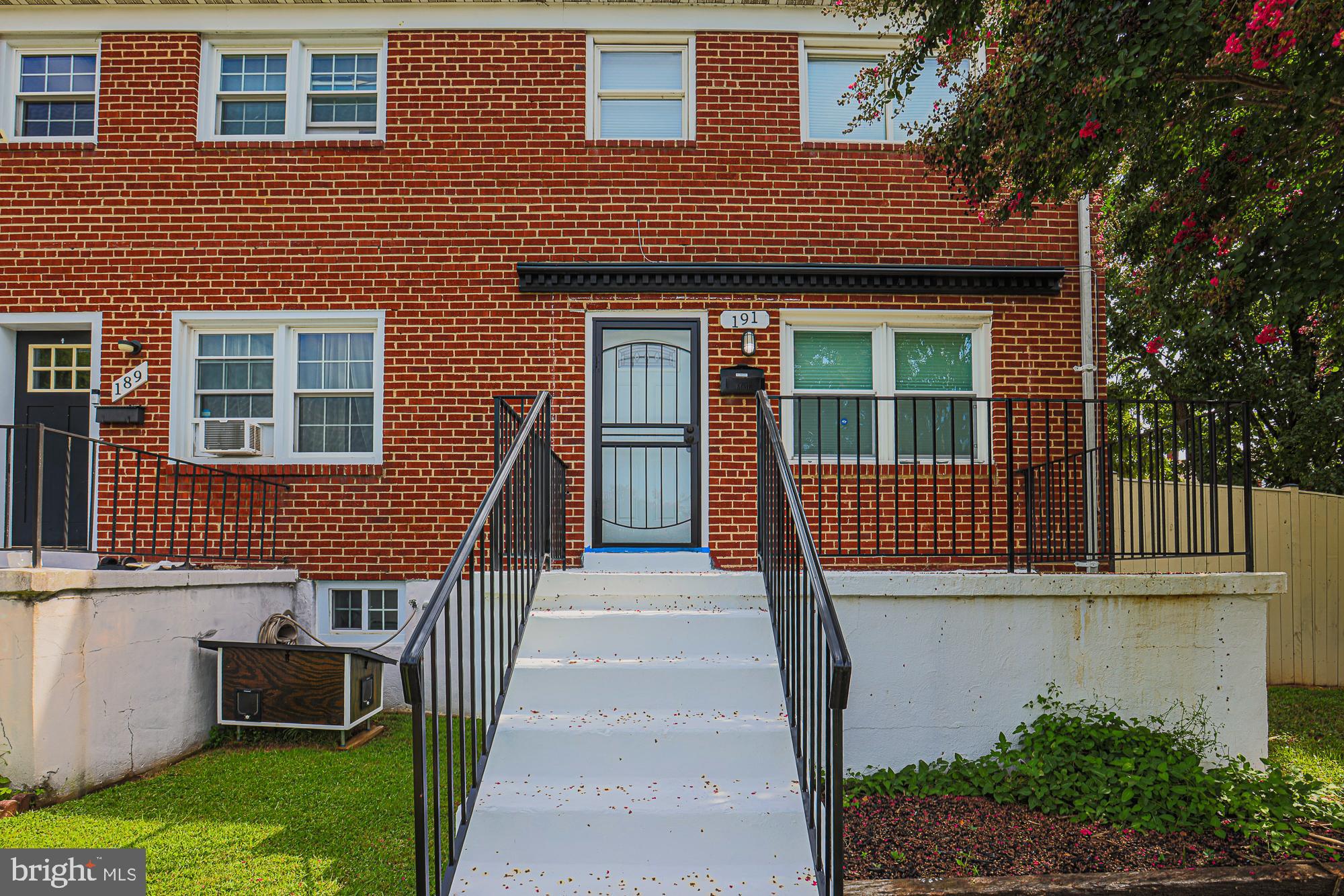 191 Alstun Road Essex, MD 21221 - Photo 2 of 40 a front view of a house with a yard
