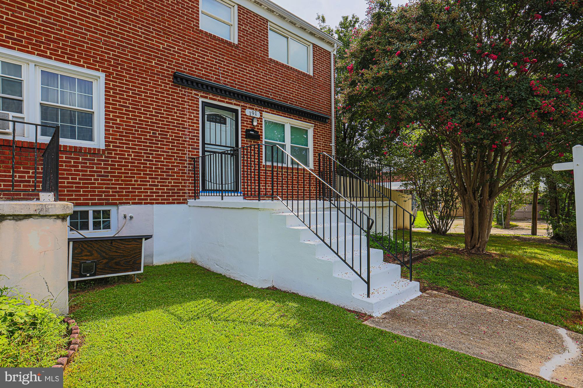 191 Alstun Road Essex, MD 21221 - Photo 3 of 40 a view of a house with a yard and a garden