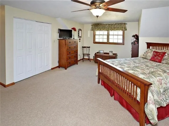 a bedroom with furniture and windows