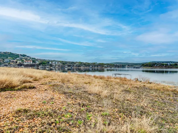 a view of swimming pool with lawn chairs