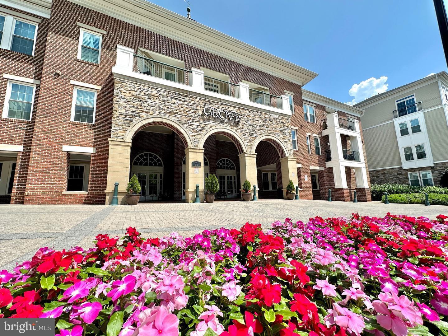 Charming entrance adorned with vibrant blooms.