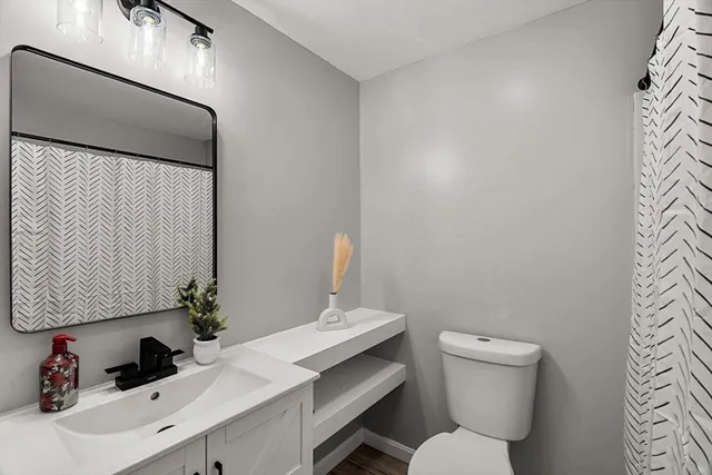 a bathroom with a toilet and a bathtub