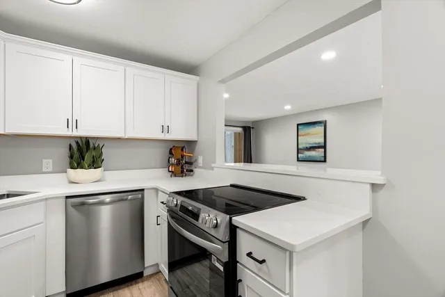 a kitchen that has a sink and a stove