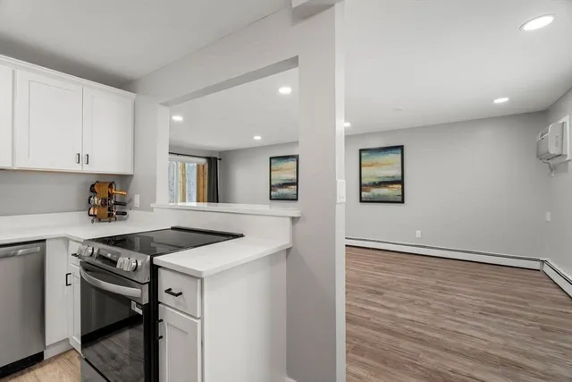 a kitchen that has a sink and a stove in it