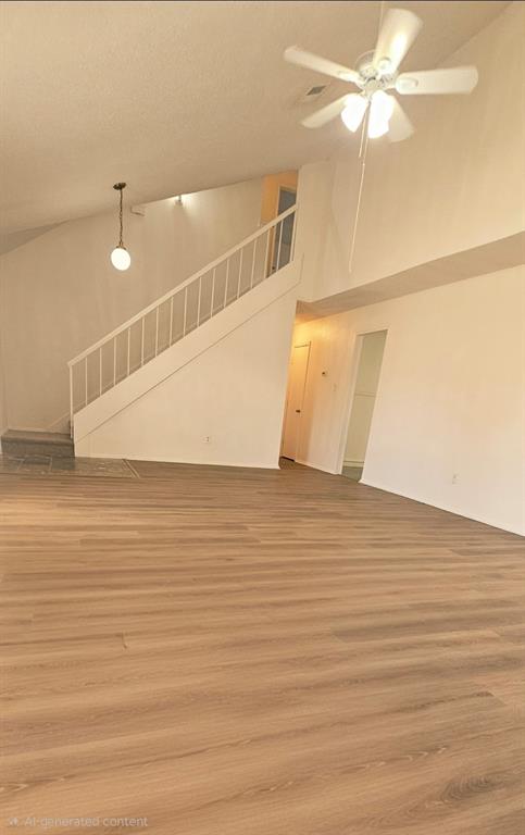 5224 Timber Creek Road Flower Mound, TX 75028 - Photo 3 of 10 an empty room with wooden floor and fan