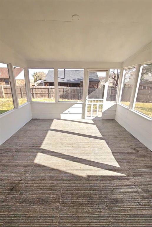 5224 Timber Creek Road Flower Mound, TX 75028 - Photo 10 of 10 a view of an empty room with wooden floor and a fireplace
