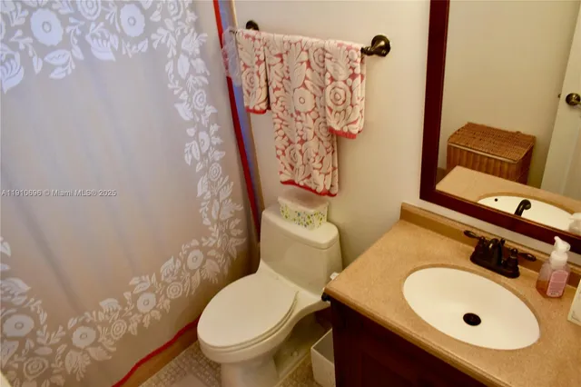 a bathroom with a sink and toilet