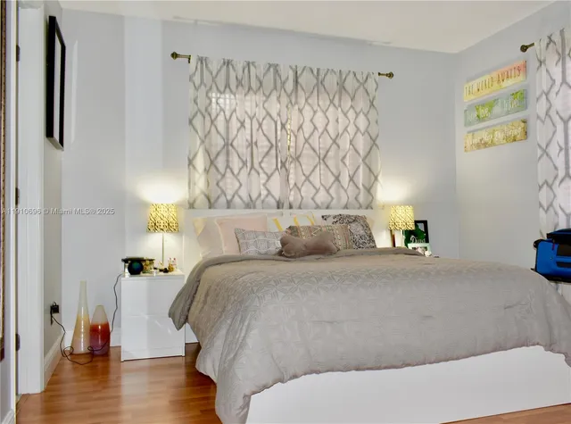 a bed room with a bed and a chair