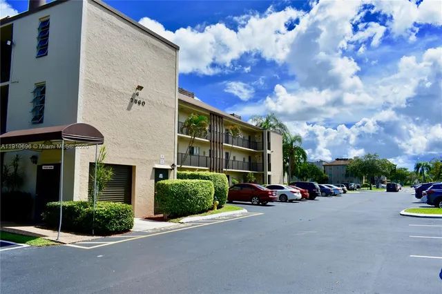 swimming pool view with a garden view
