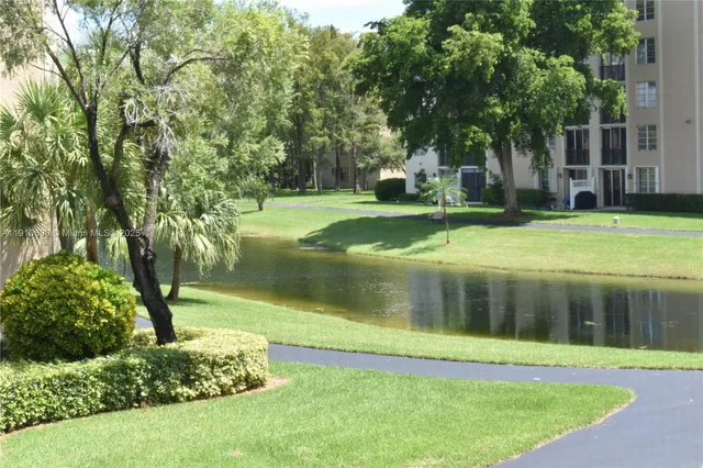 a view of a house with a yard and plants