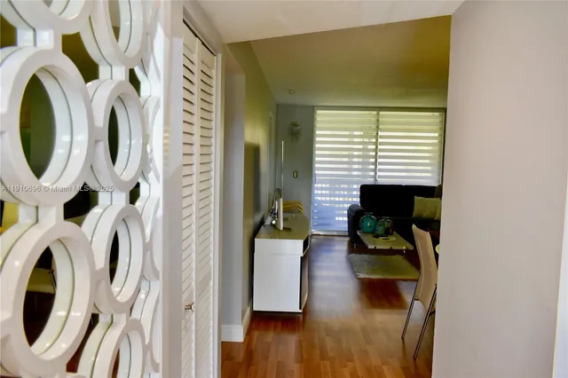 a view of living room with furniture and wooden floor