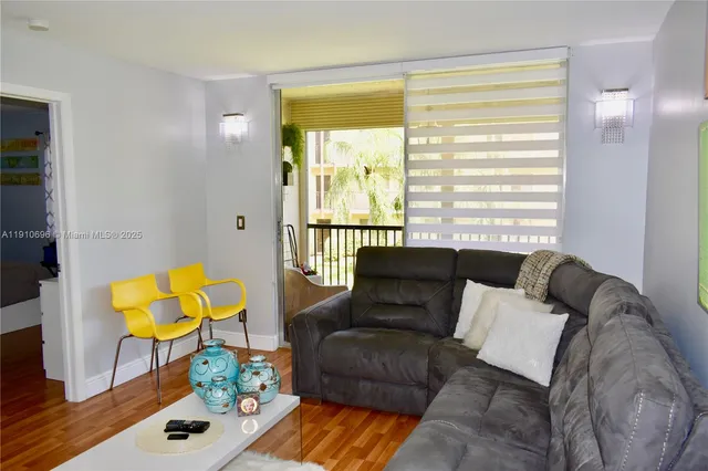 a living room with furniture and a window