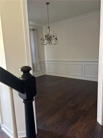 a view of a ceiling fan and wooden floor in a room
