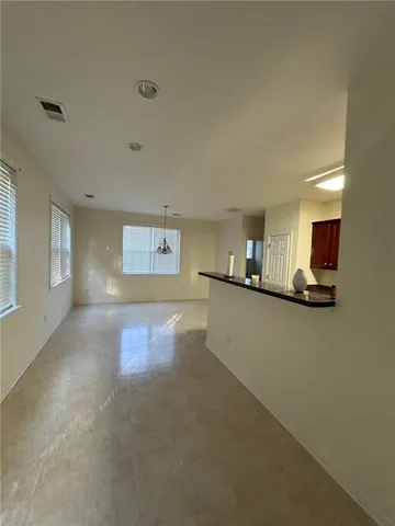 a view of a kitchen with kitchen island and a window