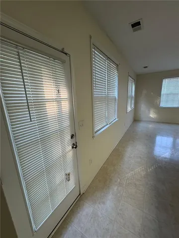 a view of a hallway with windows